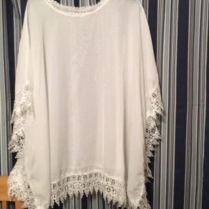 Beautiful Sheer white poncho with lace design trim.Very elegant.Smoke & pet free